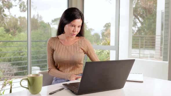 Woman working from home on her laptop