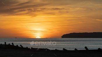 by the warm sunrise light, creating a stunning visual scene