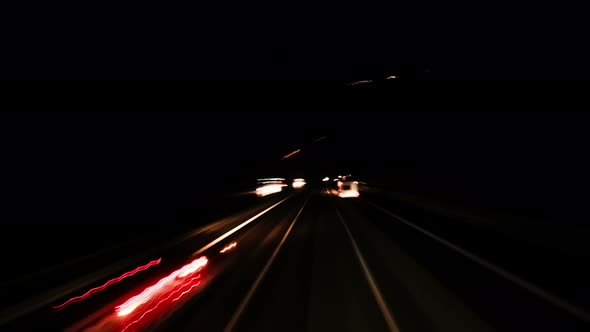 Time Lapse POV Driving on Highway at Night Blurred Traffic Light