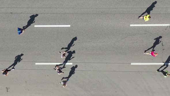 Aerial Group of Runners and Cyclist on City Road