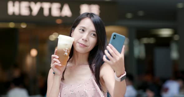 Woman drinking of fruit tea