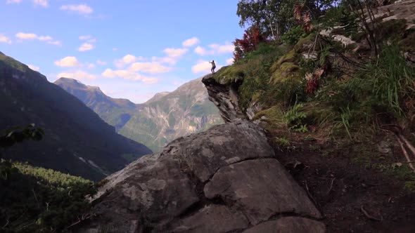 Man doing a backflip in slow motion on the edge of a cliff in Norway, Europe.