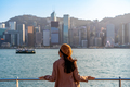 Young woman traveler relaxing and enjoying the sunset atmosphere at Victoria harbour in Hong Kong - PhotoDune Item for Sale