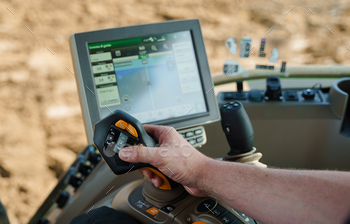 A farmer using precision agriculture and other modern farming techniques to improve agricultural