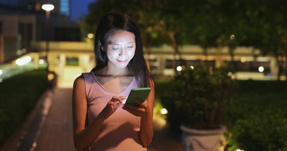 Woman use of cellphone at night 