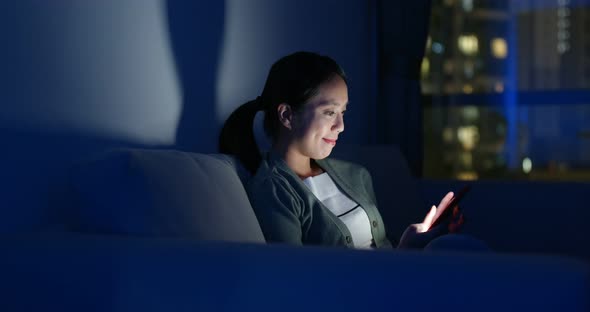 Woman use of mobile phone at night