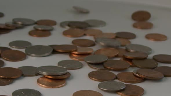 Super Slow Motion of a Bunch of Coins Falling on a Table