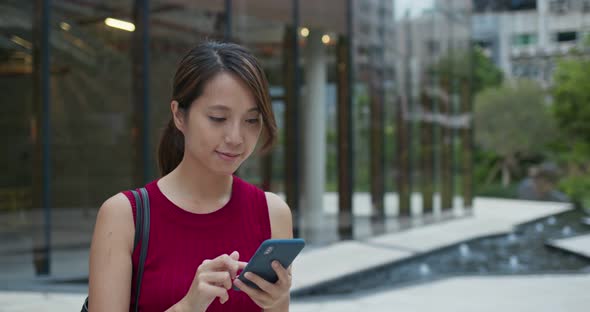 Woman use of mobile phone at street