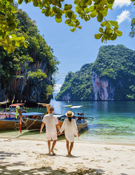 ding Krabi Thailand part of the Koh Hong Islands in Thailand. beautiful beach with limestone cliffs and longtail boats