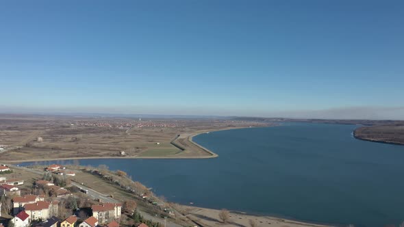 Settlement on Danube river banks 4K aerial video