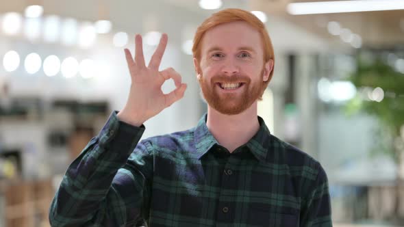 Portrait of Beard Redhead Man with Ok Sign By Hand 