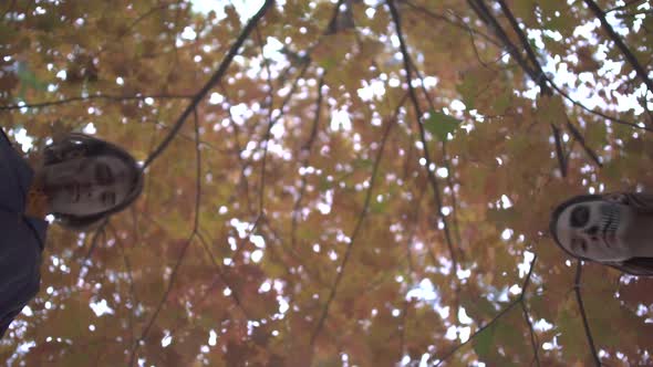 Man and Woman in Halloween Costumes Looking Down on the Victim with Serious Scary Faces in Autumn