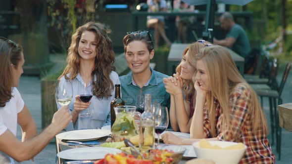 Happy Friends In Outdoor Picnic Party Having Fun