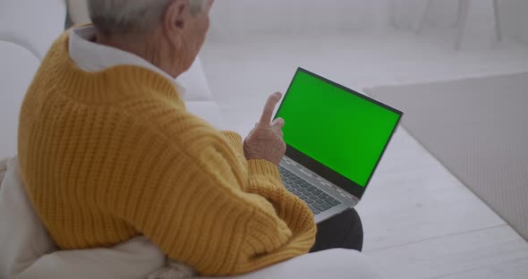 Elderly Woman Looks Monitor Green Screen Talks Via Video Link Her Granddaughter Daughter Doctor