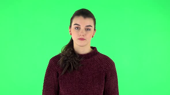 Upset Girl Shrugs and Shakes Her Head Negatively. Green Screen