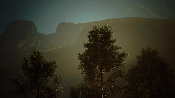 Scenic Landscape with Steep Cliffs and Trees During a Sunny Day