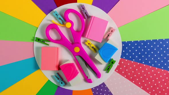 School Office Supplies on Colorful Paper Background
