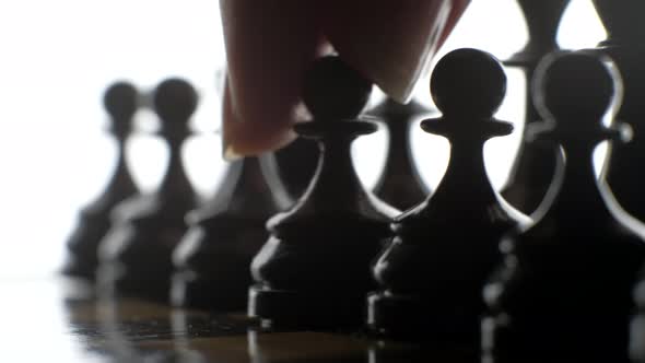 Game of chess, the silhouette figures on a white background.