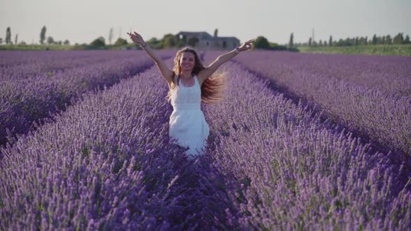 Girl Hops Among the Lavender Plants