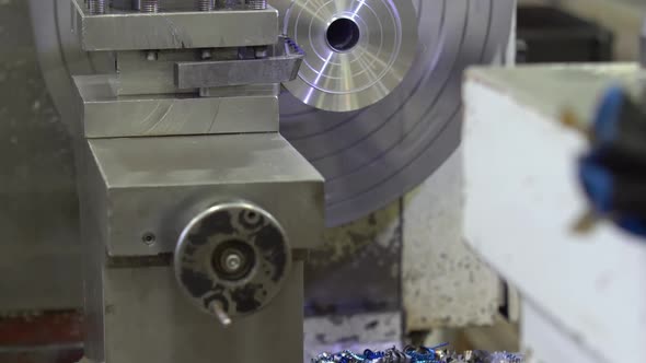 The Operation of Lathe Machine Cutting the Metal Shaft Parts