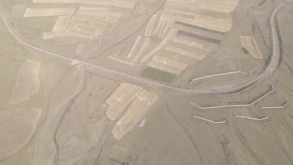 Samtskhe Javakheti, Georgia - August 28 2021: Aerial view of Snow protection fences near railroad.