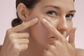 Skin Problem. Depressed Woman Touching Pimple On Her Face - PhotoDune Item for Sale