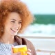 Beautiful Pensive Redhead Woman at the Beach Drinking Tea - VideoHive Item for Sale