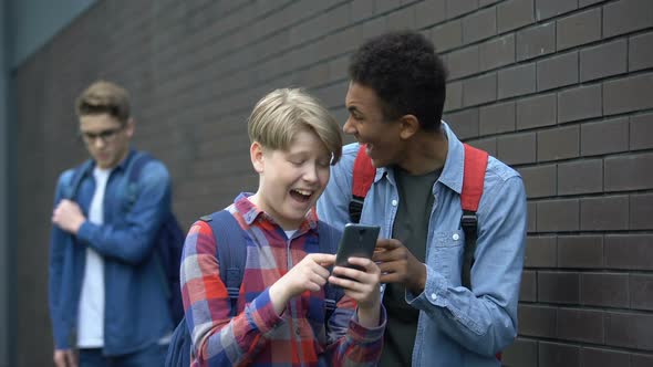 Boys Laughing at Video About Classmate, Offensive Post in Network, Cyberbullying