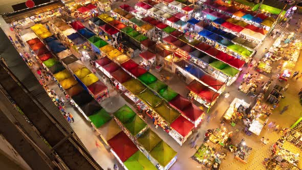 Time lapse of aerial top view of Night Market people walking street