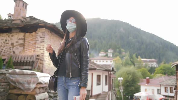 Tourist Woman with Face Mask Exploring Old Town Post COVID Pandemic