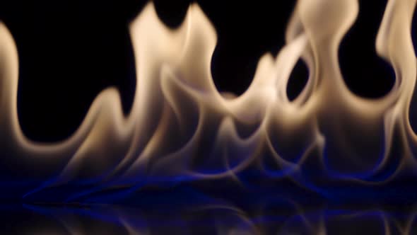 Flammable Liquid or Petrol Stains on Black Reflective Background Flash and Ignite