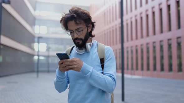Excited Young Adult Man Receiving Good News on Sms Message