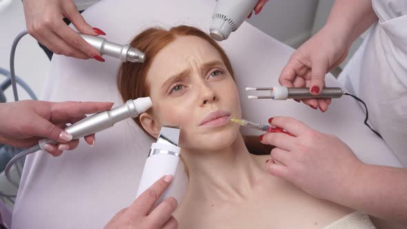 Image of a Young Woman, Around Her Face Many Hands of Cosmetologists with Various Cosmetic Devices