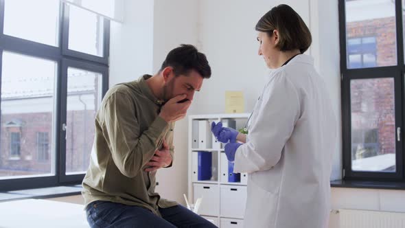 Doctor Checking Male Patient's Throat at Hospital