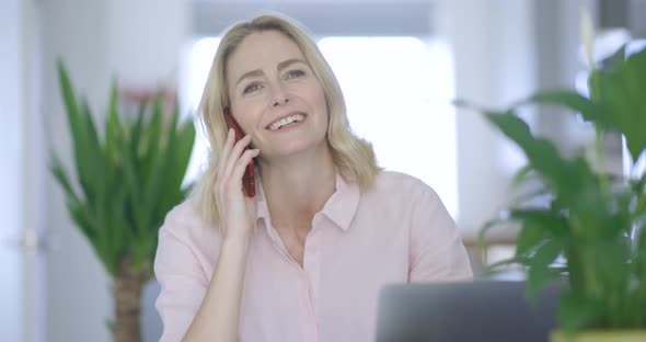 Confident businesswoman talking on the phone