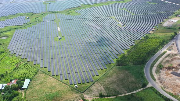 Aerial view of Ecology solar power station panels in the fields green energy. Landscape electrical i