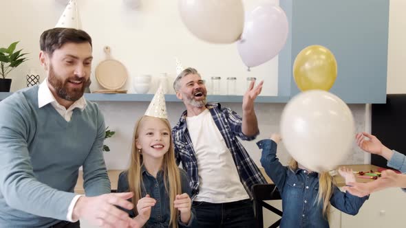 Multigeneration Family on a Indoor Birthday Party