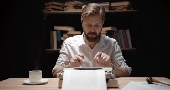 Bearded Writer Typing Indoors