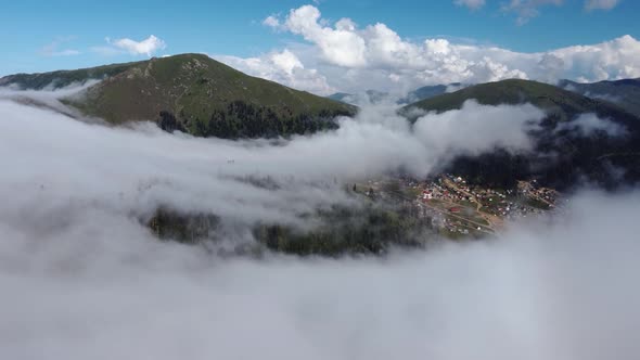 Misty Aerial View Of High Mountain Village