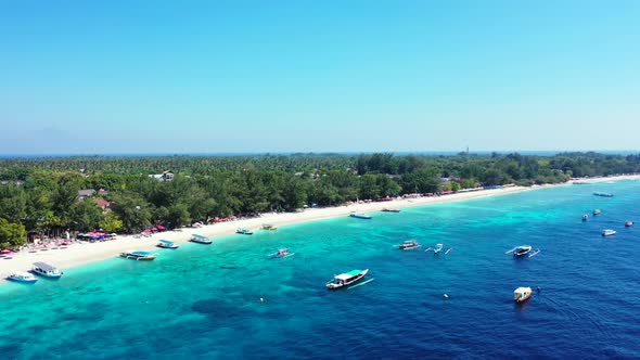 Aerial top down travel of idyllic island beach lifestyle by blue green water and white sand backgrou