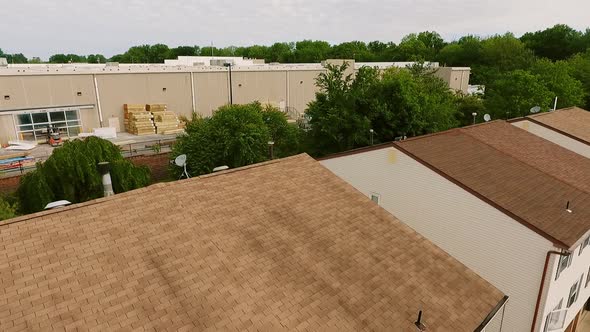 Real Estate Drone Aerial View Establishing Shot of American Neighborhood and Logistics Center with