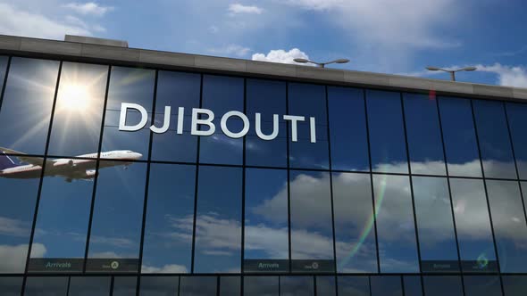 Airplane landing at Djibouti Jibuti airport mirrored in terminal