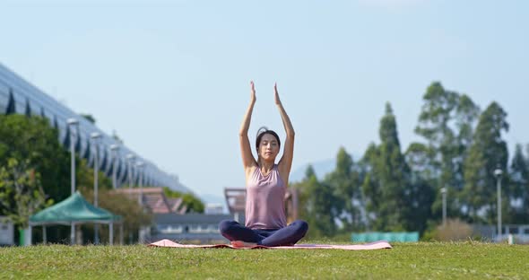 Woman do yoga at park