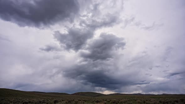 Dramatic row of dark clouds moving through the sky in timelapse
