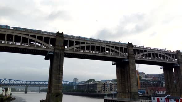 Pan Video of Train passing over the Tyne River over the High level bridge in Newcastle, England