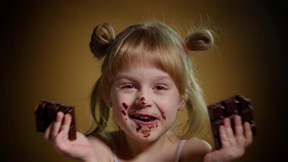 Closeup Portrait of Teen Child Kid Girl Eating Milk Chocolate Bar Addiction of Sweets and Candies