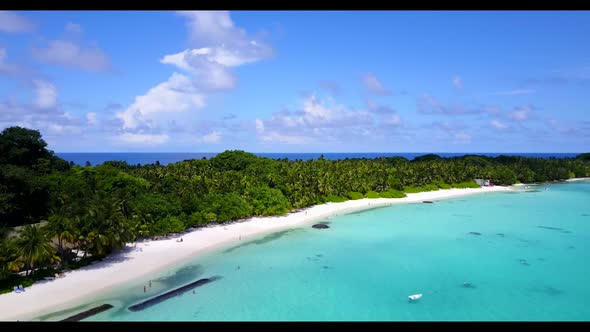 Aerial panorama of marine coast beach vacation by transparent ocean with white sand background of a 