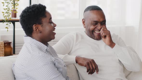 Family Couple Afro American Woman Daughter and Black Adult Mature Middle Aged Man Father Sit at Home