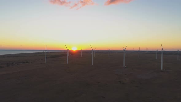 Aerial View of Wind Farm with Wind Turbine Windmills at Sunset at the Sea Coast in Bulgaria