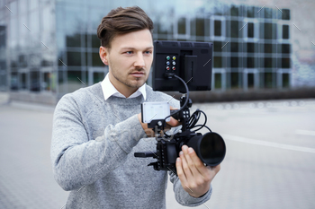 Professional videographer with a modern camera rig
